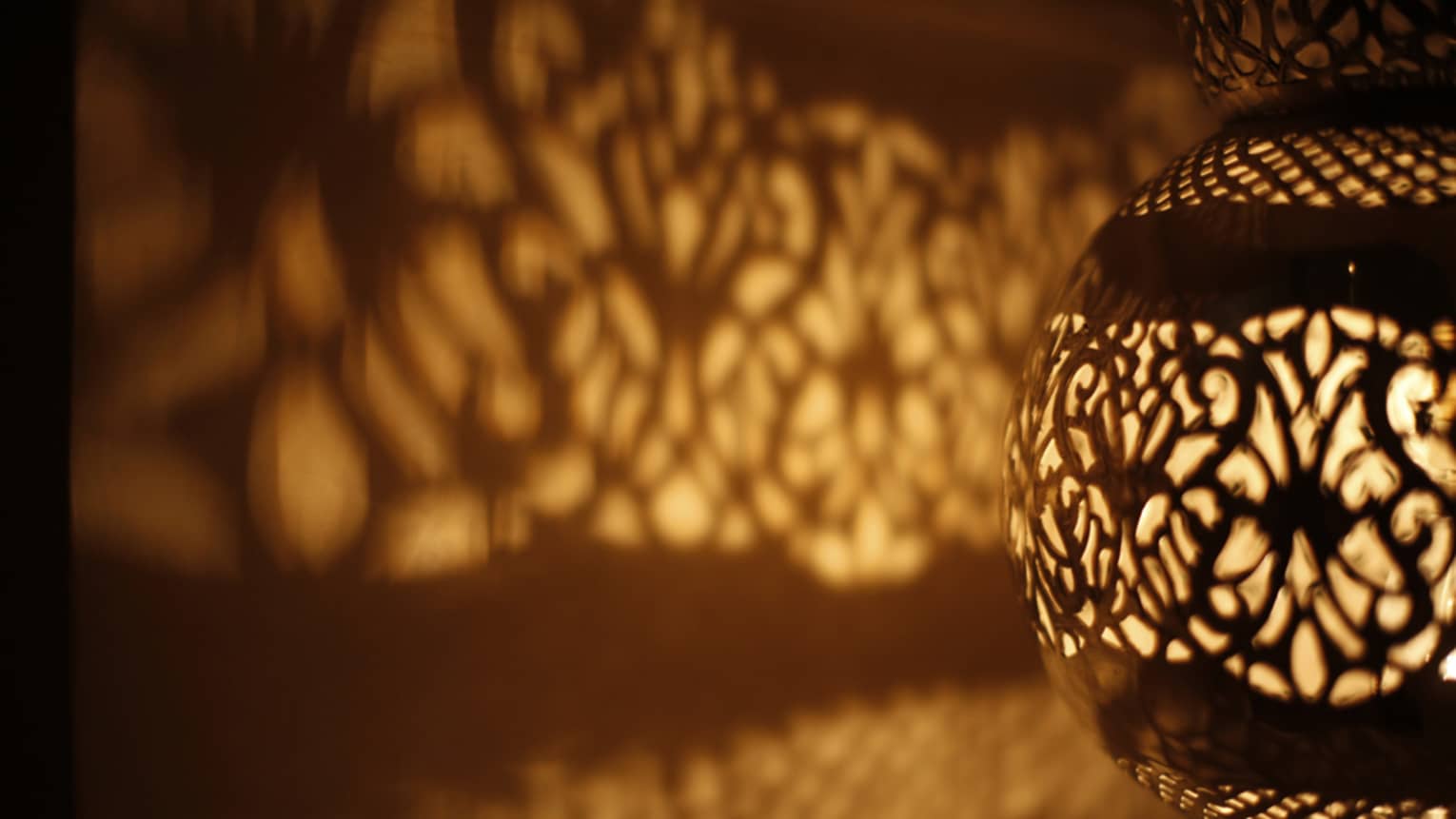 Pattern of light on wall from illuminated Turkish lamp