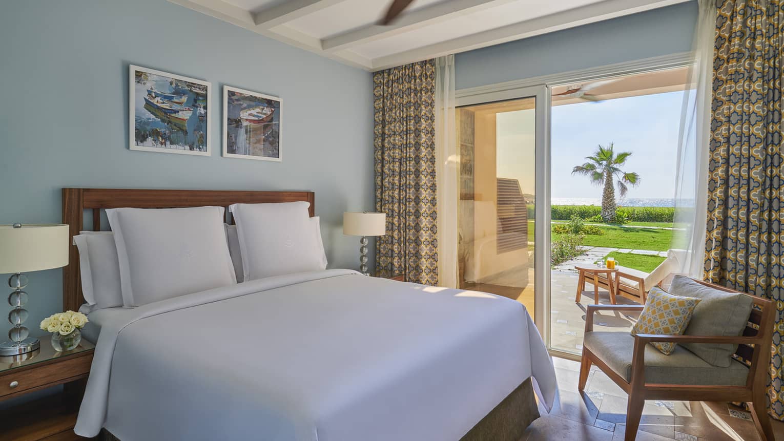 A freshly-made bed in the beach suite overlooking the marsh