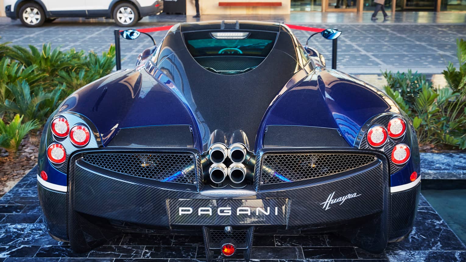 Luxury modern Pagani car parked on marble driveway