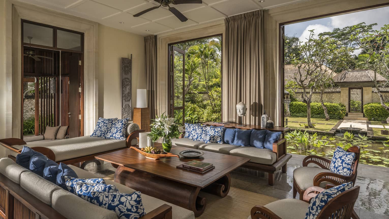 Sofas, table in open-air three-bedroom garden residence villa living room