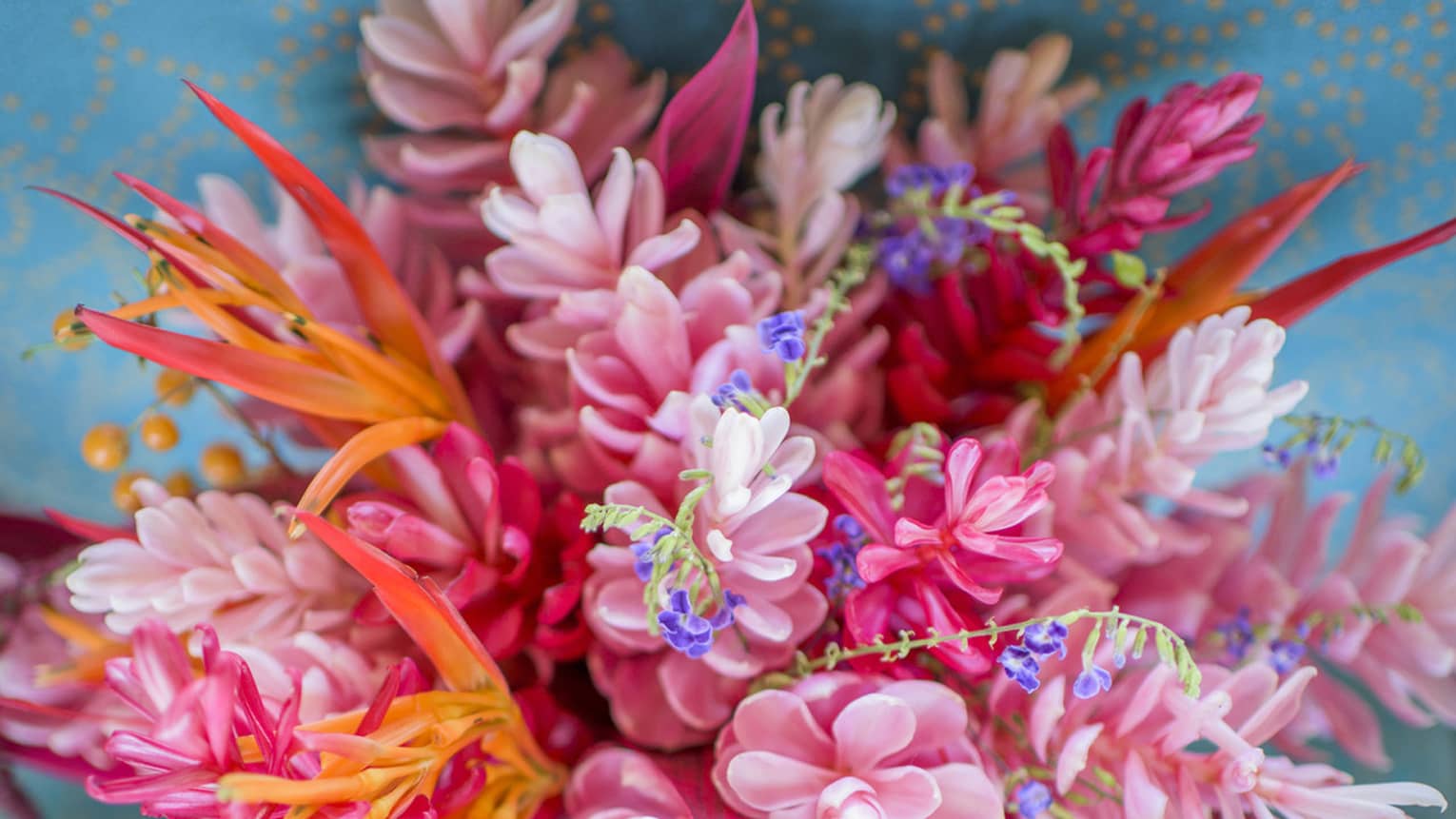 Wedding bouquet of pink and orange tropical flowers 