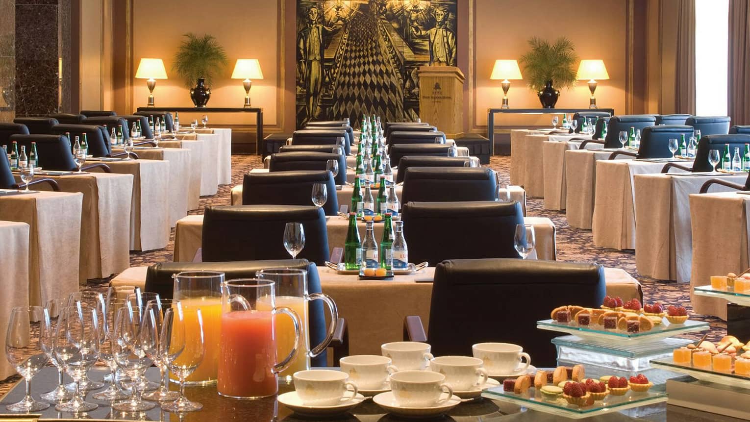 Pessoa Room breakfast buffet with fresh juice, pastries in front of rows of meeting tables