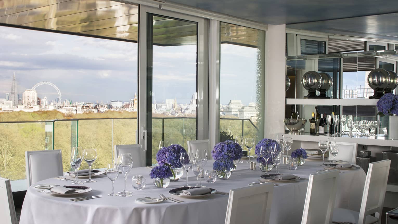 Private dining table along sunny window with London views in Tenth Floor Lounge 
