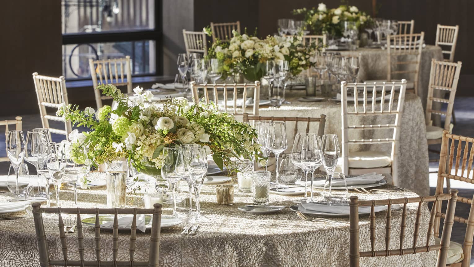 round wedding table with lavish flower centerpiece
