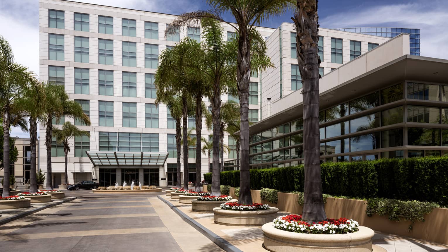 Four Seasons Hotel Silicon Valley at East Palo Alto exterior courtyard, potted palm trees 