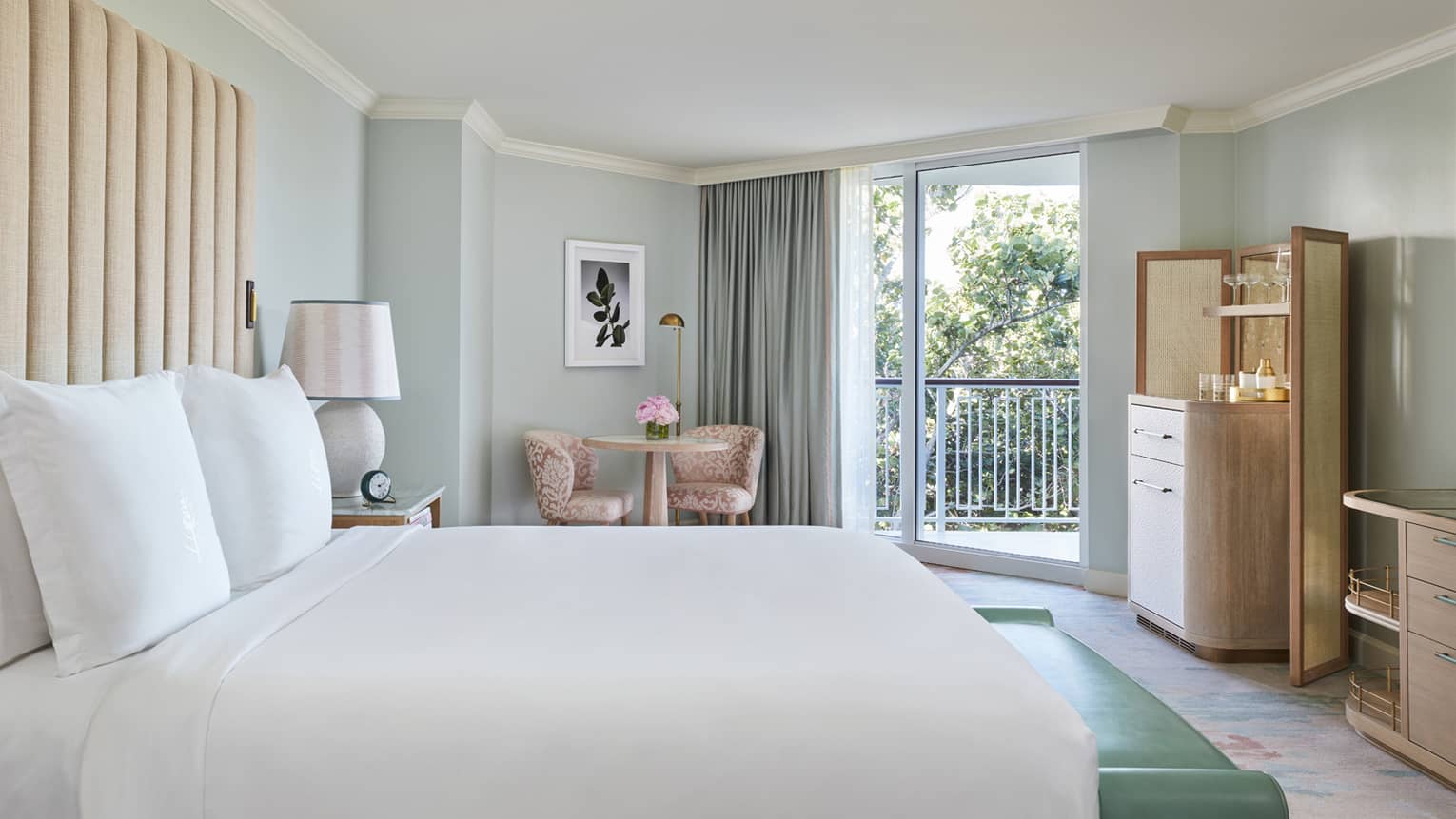 Guest room with a Four Seasons queen bed and garden views