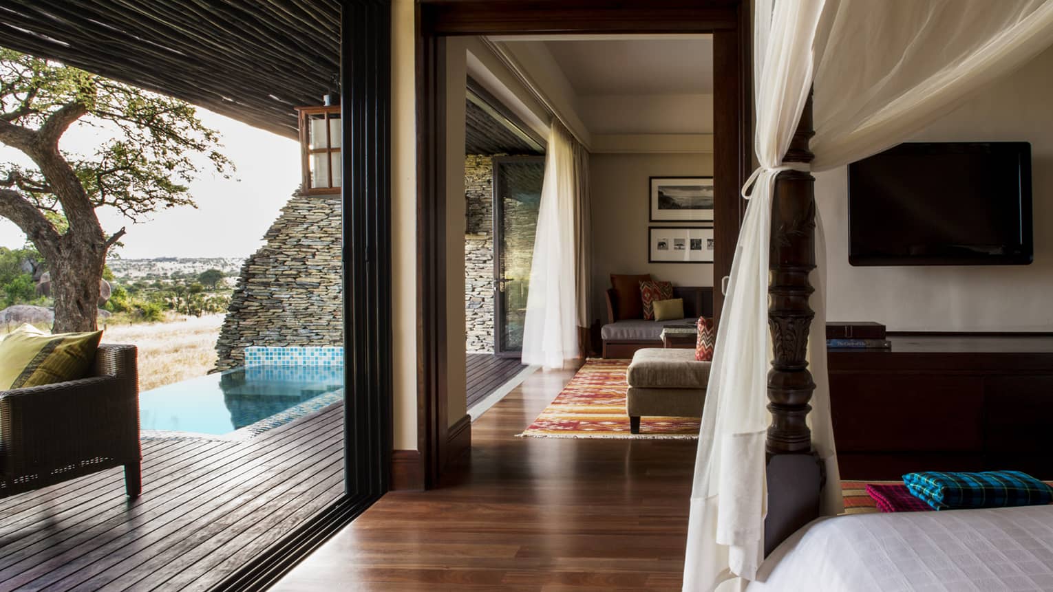 Terrace Suite Waterhole View poster bed, canopy by open wall to plunge pool