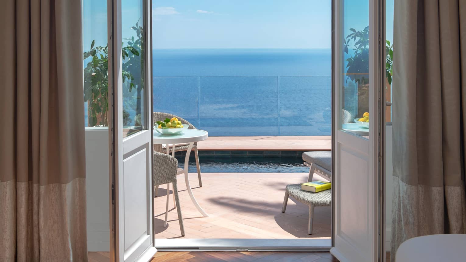 Door leading to private terrace with plunge pool overlooking the sea