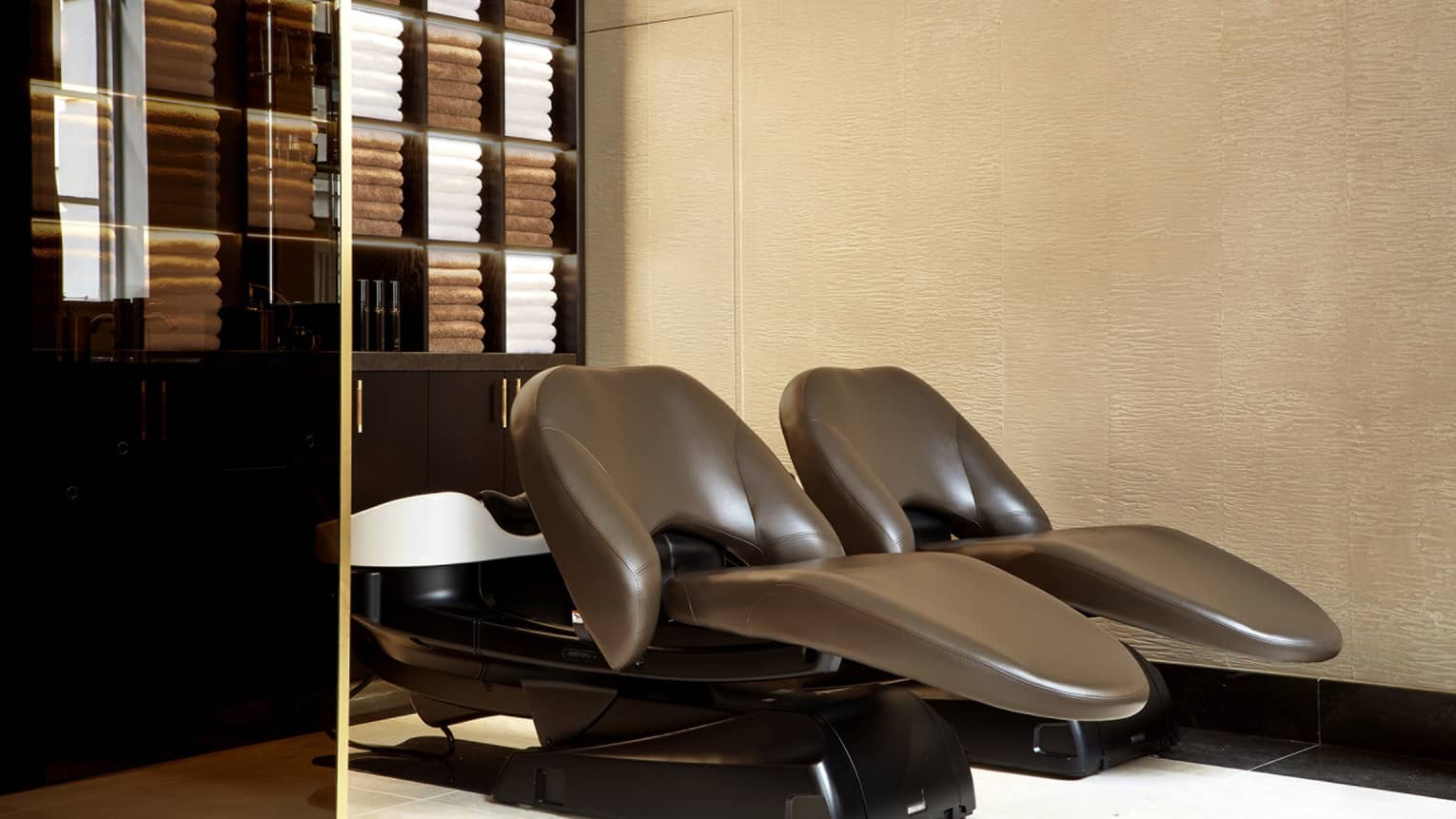 Gielly Green salon with warm-toned brown leather reclining chairs