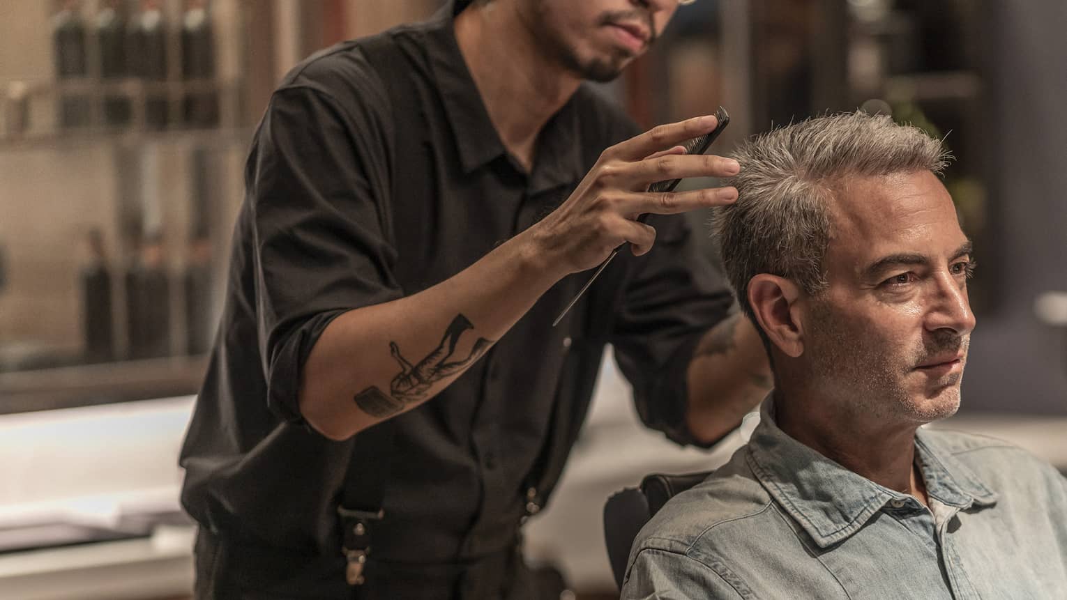Man receives haircut in the Spa's barbershop