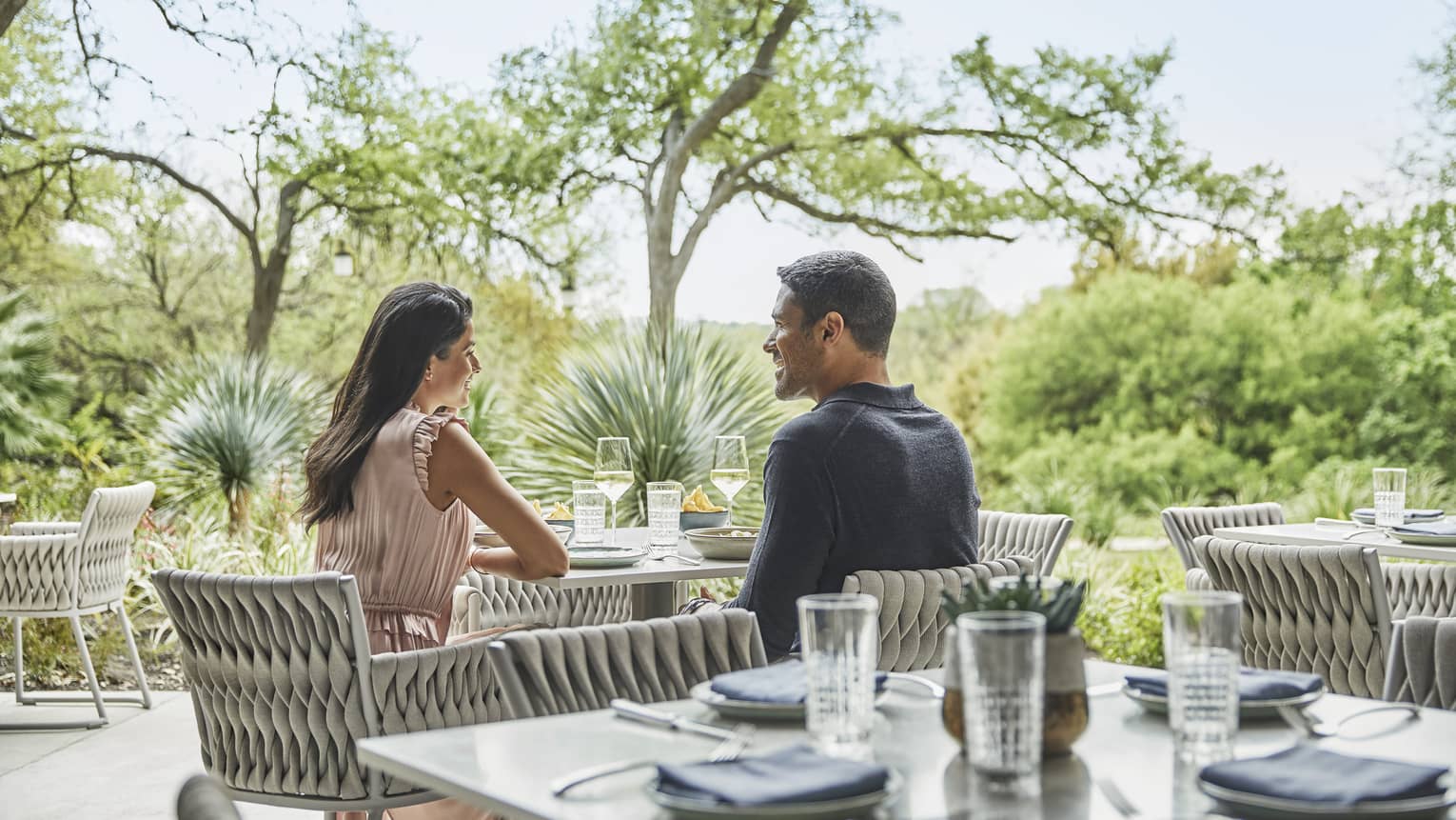 A couple shares a romantic meal on the outdoor terrace at Ciclo.