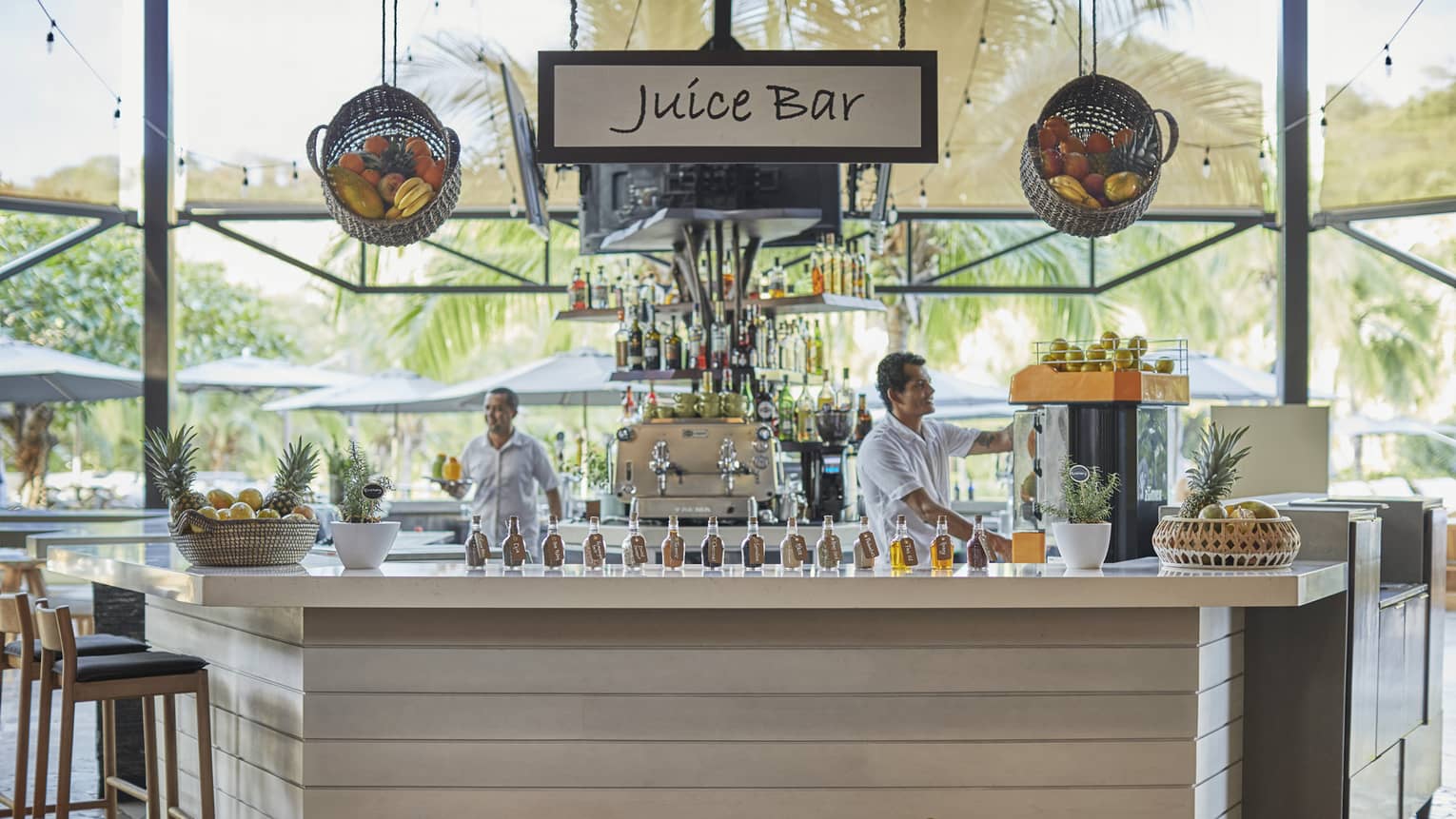 Baskets of fruit adorn the exterior of the wooden paneled juice bar