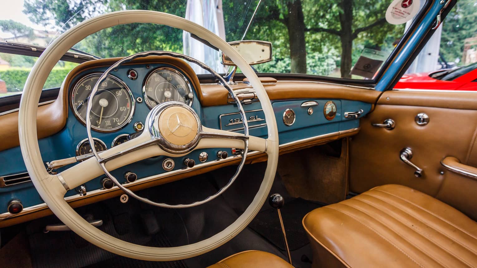 Wheel, dashboard, leather seats of classic luxury car