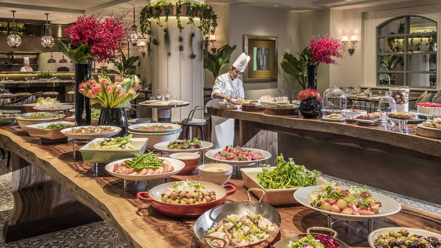 A lunch buffet arranged with platters of seafood, fresh vegetables and a large variety of other options at the One Ninety Restaurant