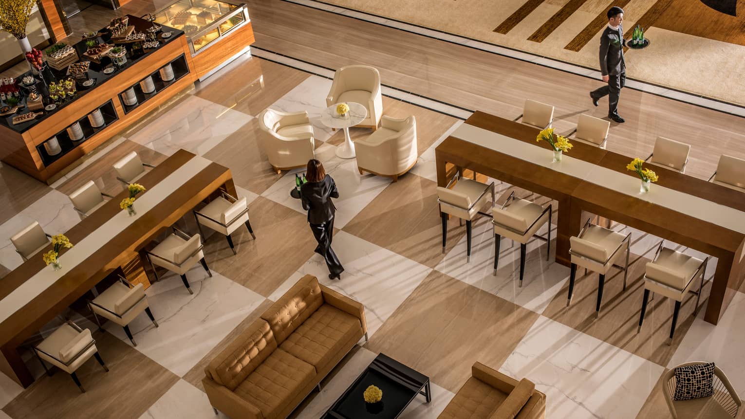Aerial view of hotel staff walking through Foyer lounge seating areas