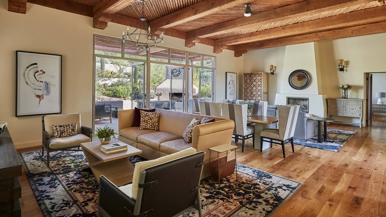 Living room and dining area, with rich wooden floors and beamed wooden ceiling