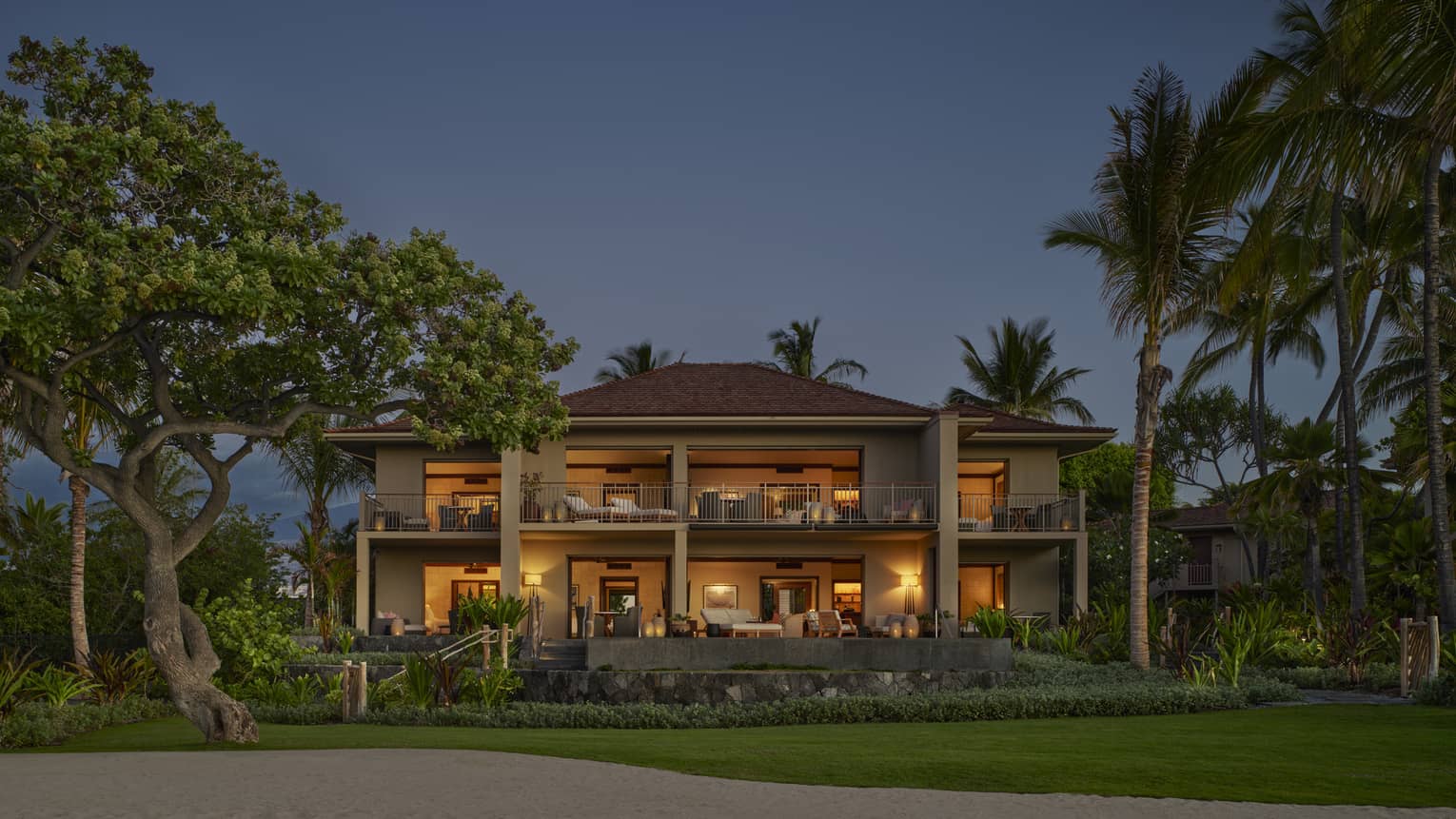 Exterior of large villa with tropical landscaping