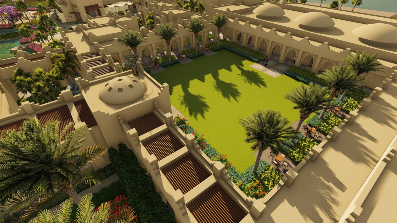 Aerial view of Tiran Courtyard flanked by palm trees and colourful flowers