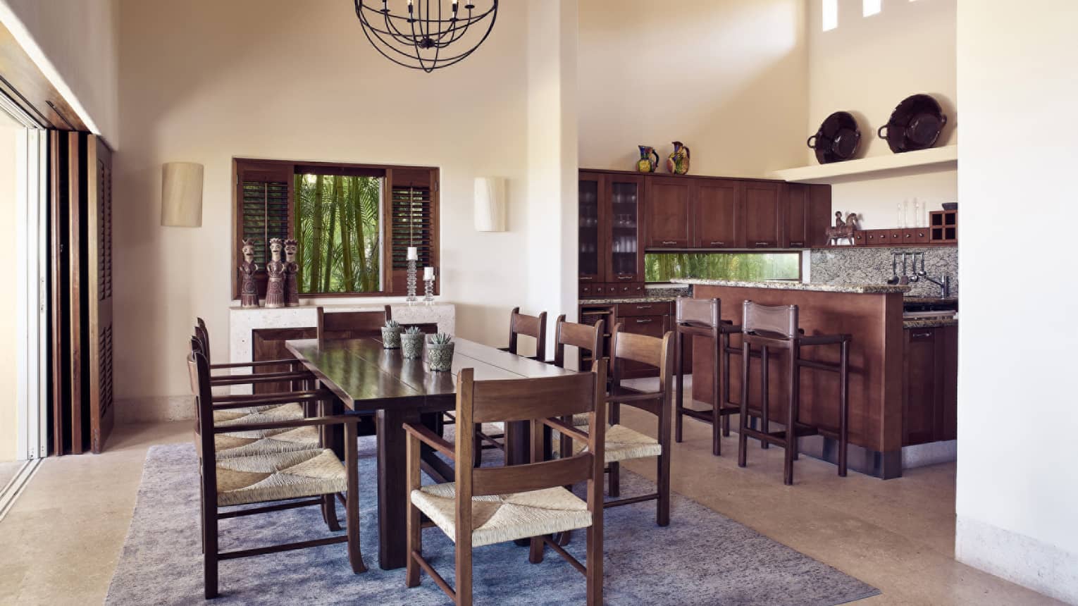 Kitchen and dining area with wooden table and chairs for eight