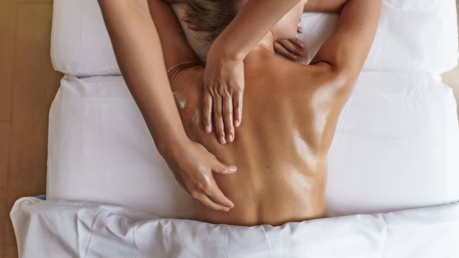 Overhead view of woman's back getting a massage