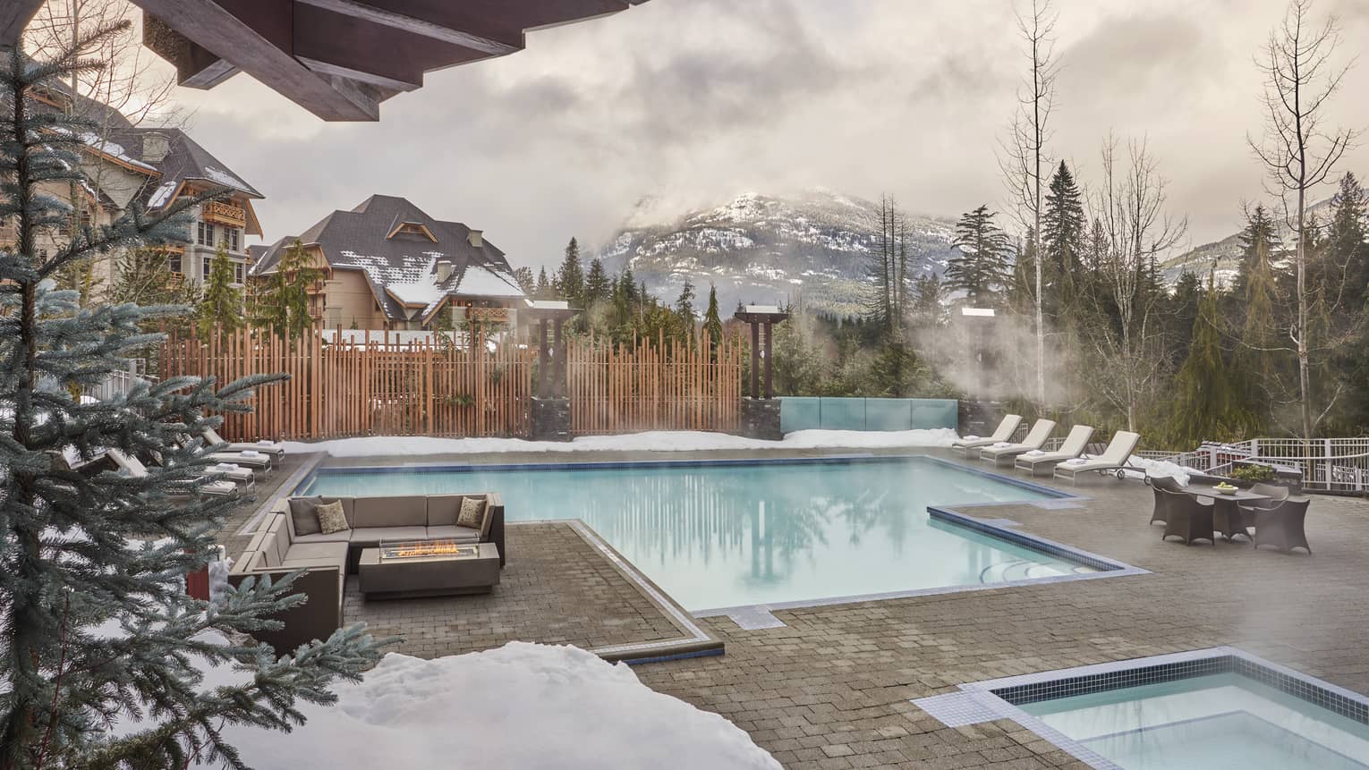 A heated outdoor pool during the winter season.