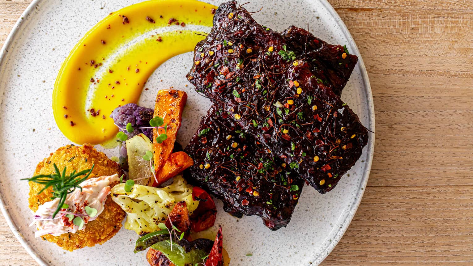 Colourful food on a white plate.