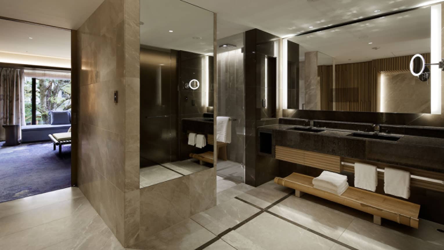 Large bathroom with double vanity, walk-in shower and full-length mirror