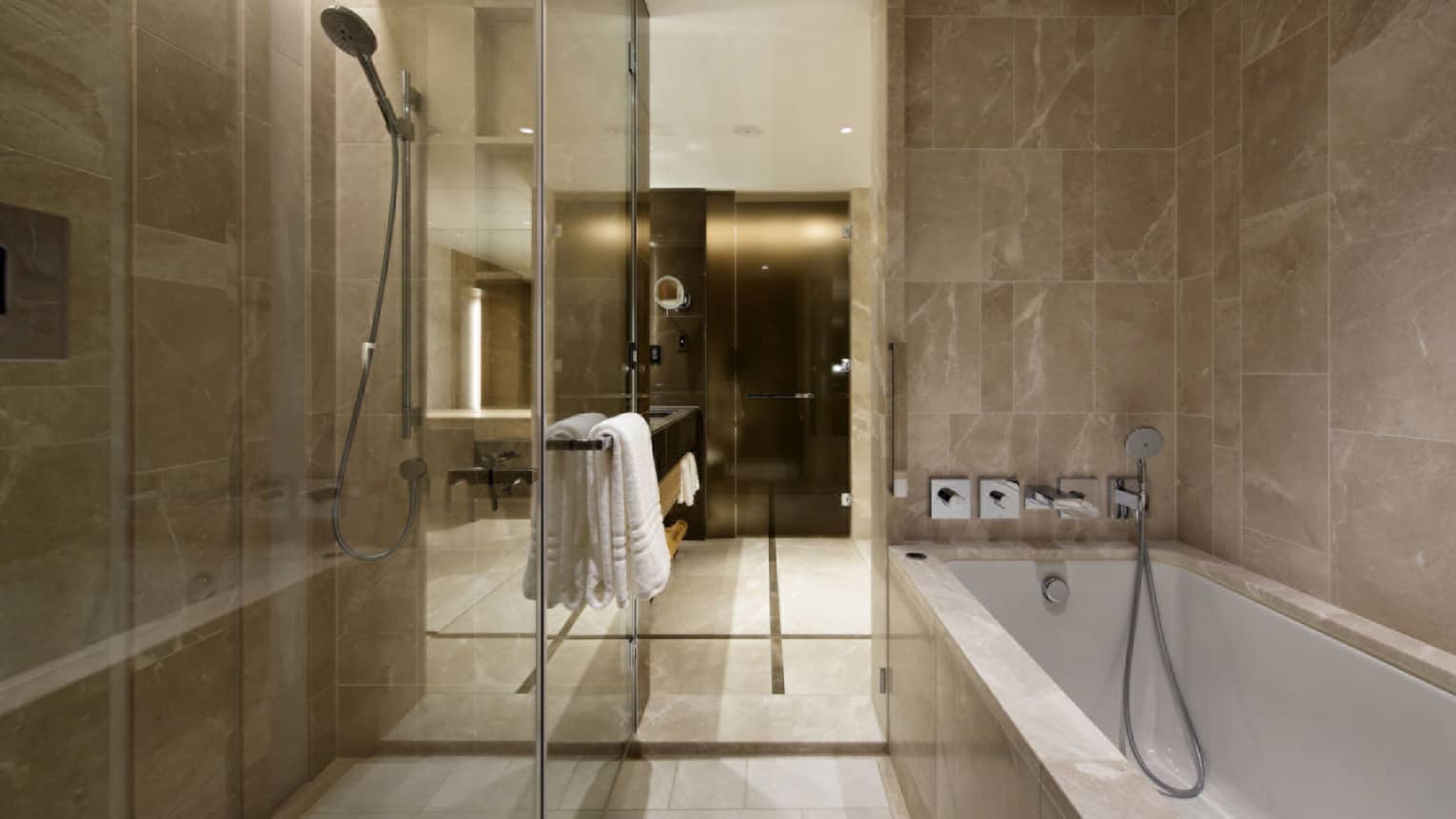 Bathroom with walk-in glass shower and separate tub