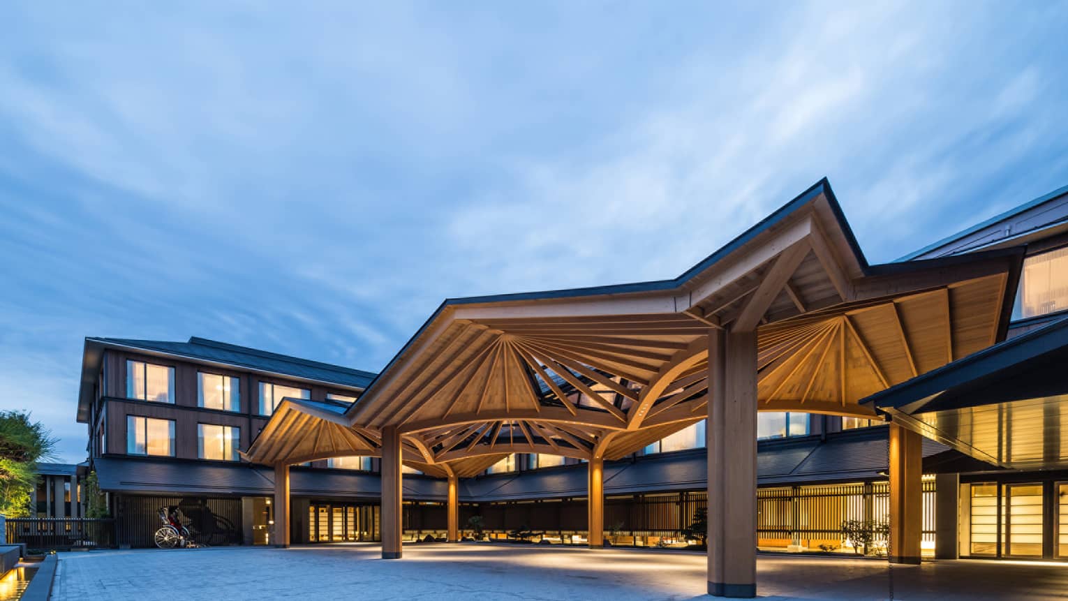 Modern awning over Four Seasons Hotel Kyoto entrance at dusk