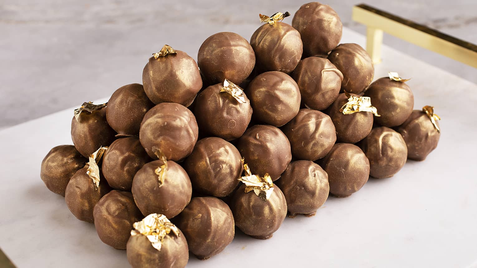  Turkish coffee truffles featuring a gold-covered dark chocolate shell, Turkish coffee ganache and gold sheet