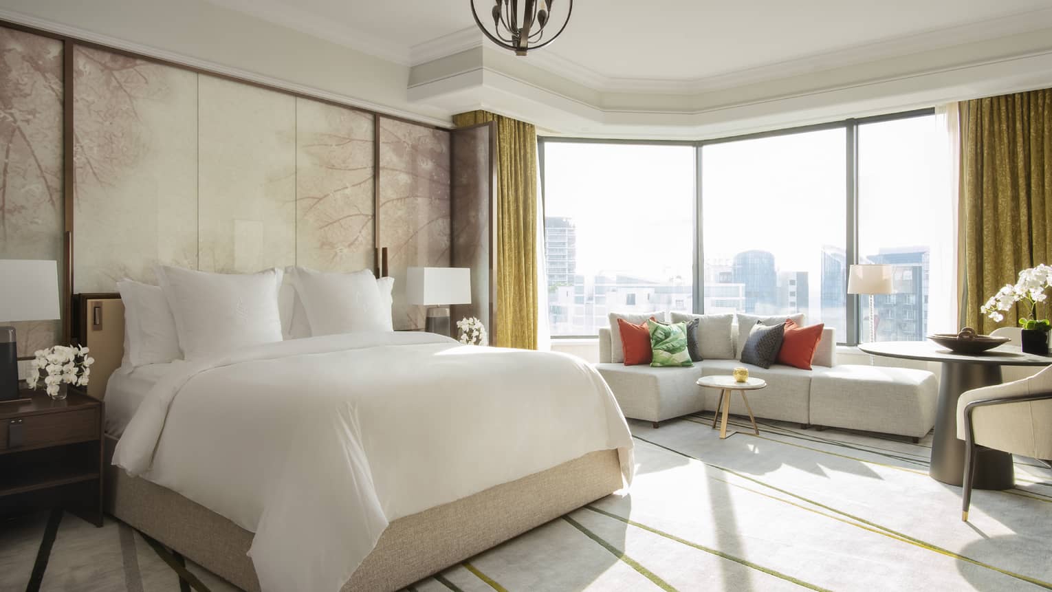 Royal Suite bedroom with floor-to-ceiling windows with a view of the city