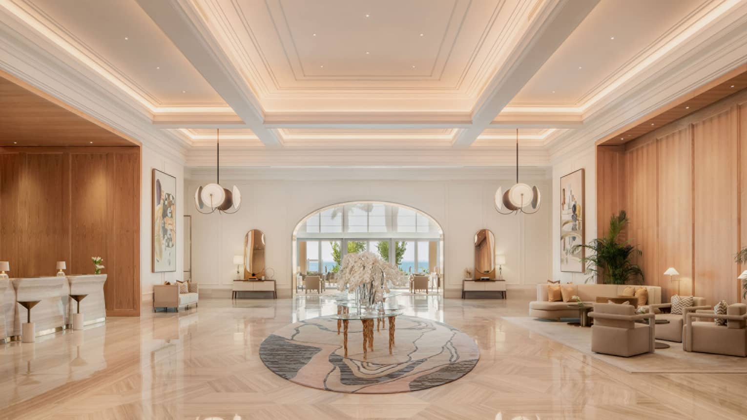 Elegant lobby with marble floors and large floral centrepiece
