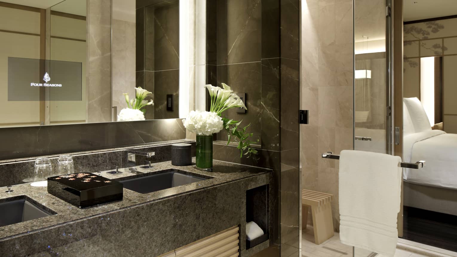 Bathroom with two sinks and glass shower