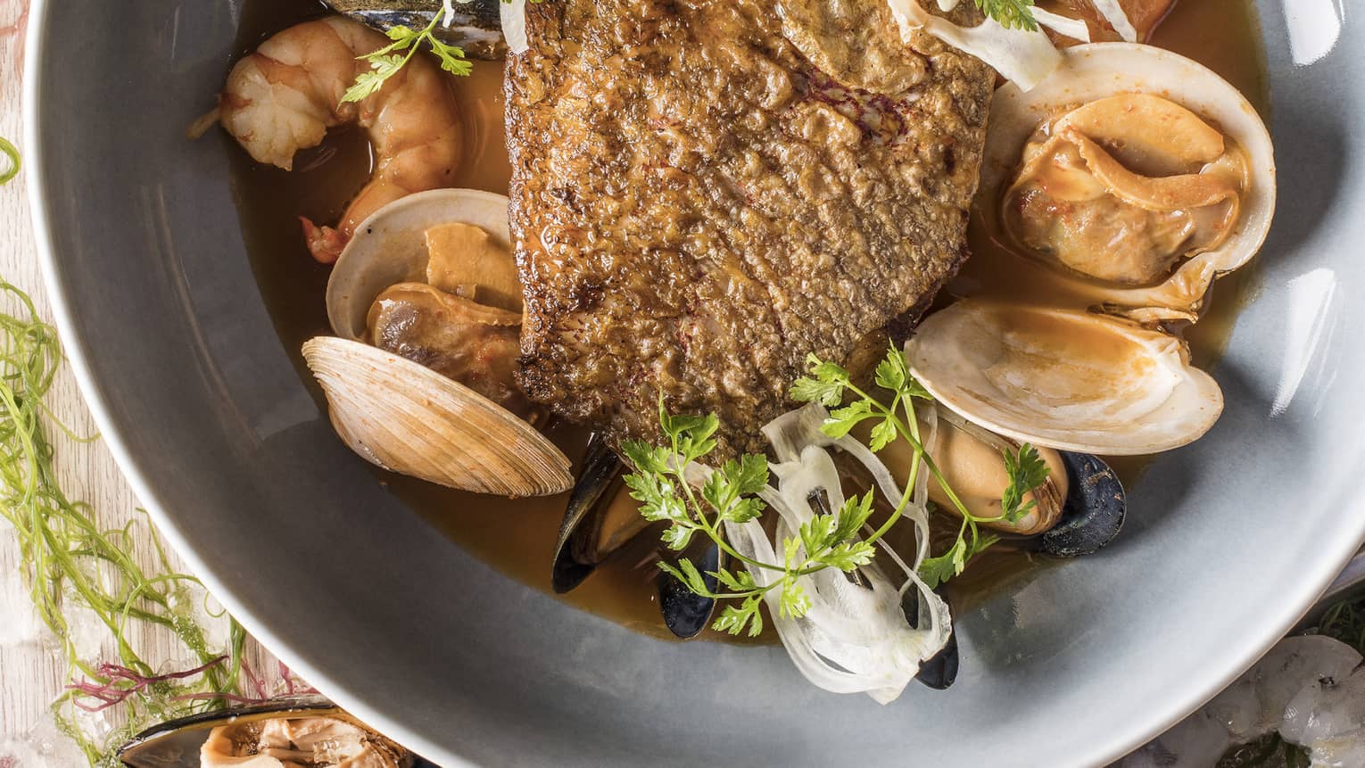 Snapper bouillabaisse with spicy diakon and lemongrass