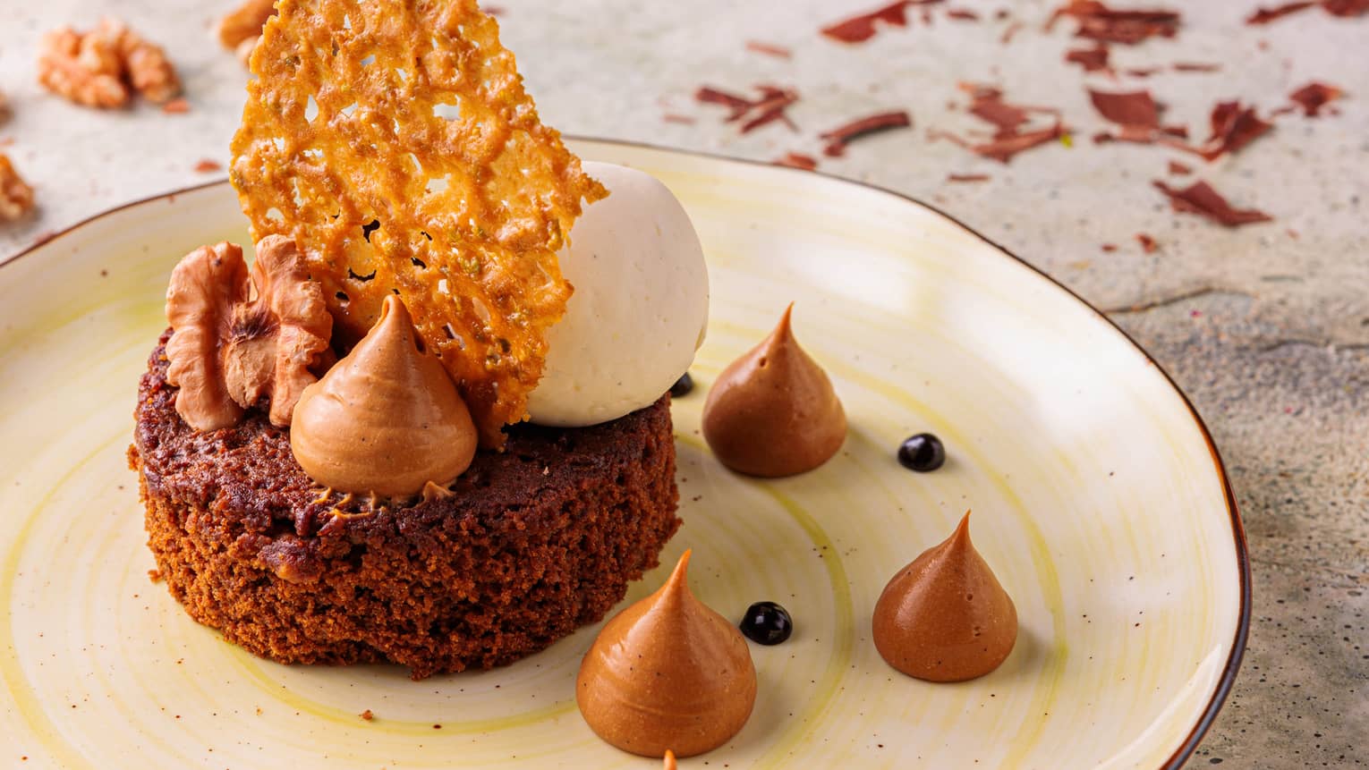 A brownie with molasses on a plate.