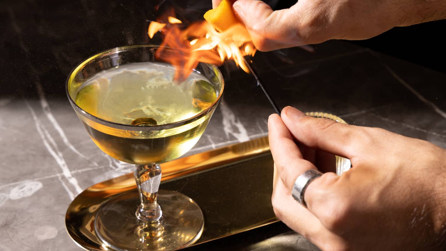 A cocktail with a flame.