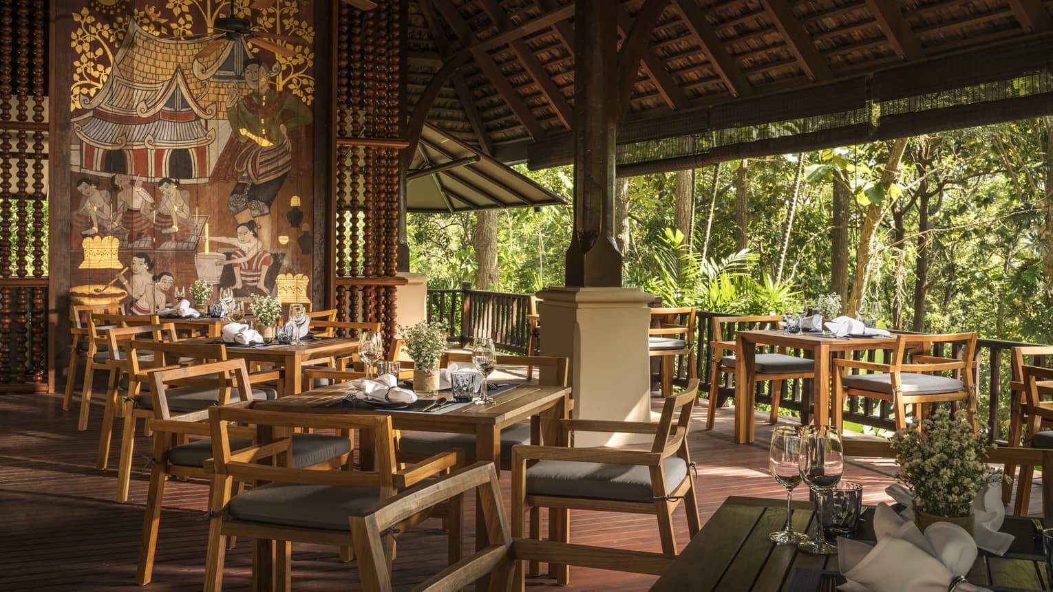 Rim Tai dining tables, chairs in open-air restaurant room