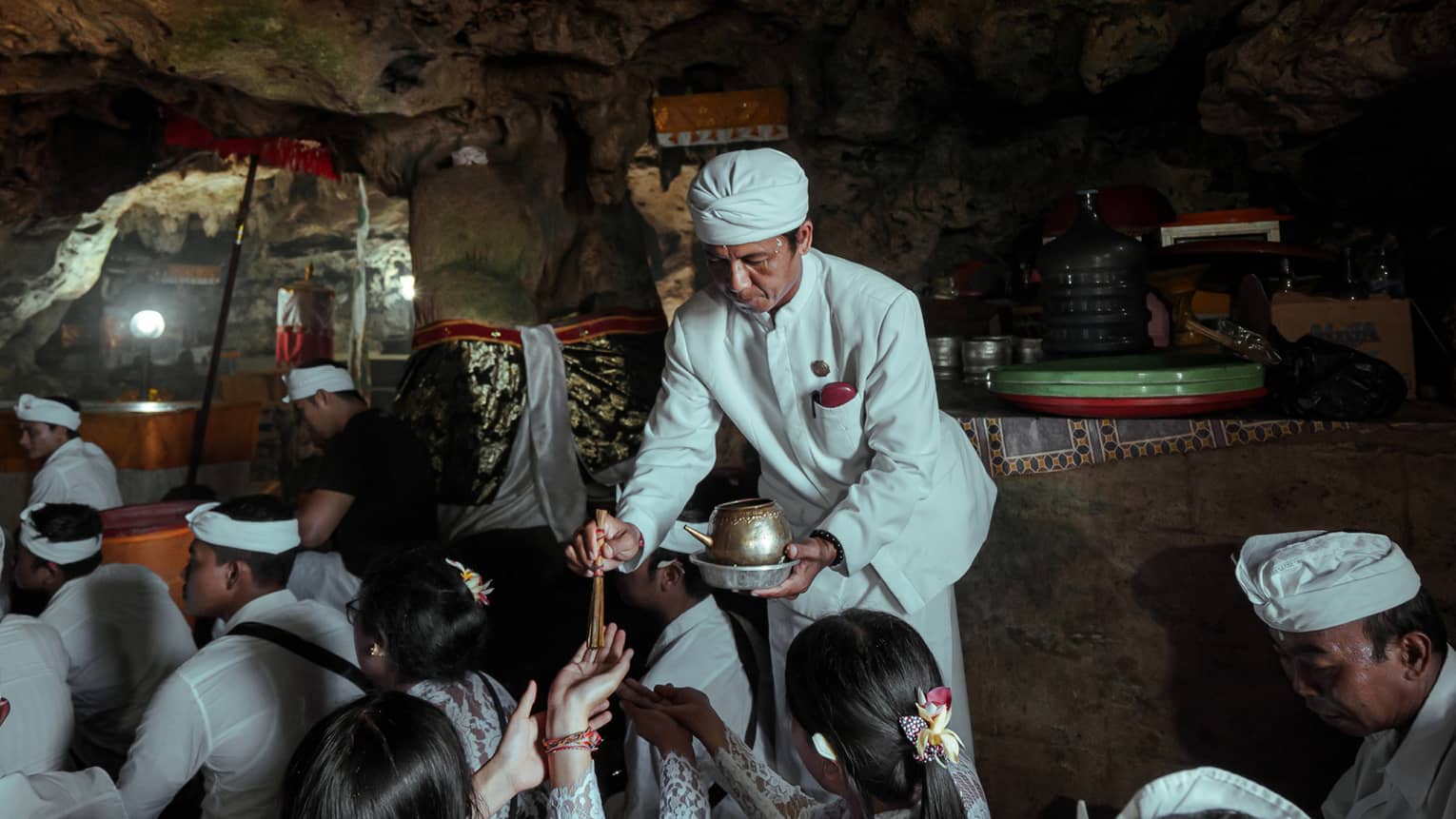 A healing ritual is performed within a cave temple