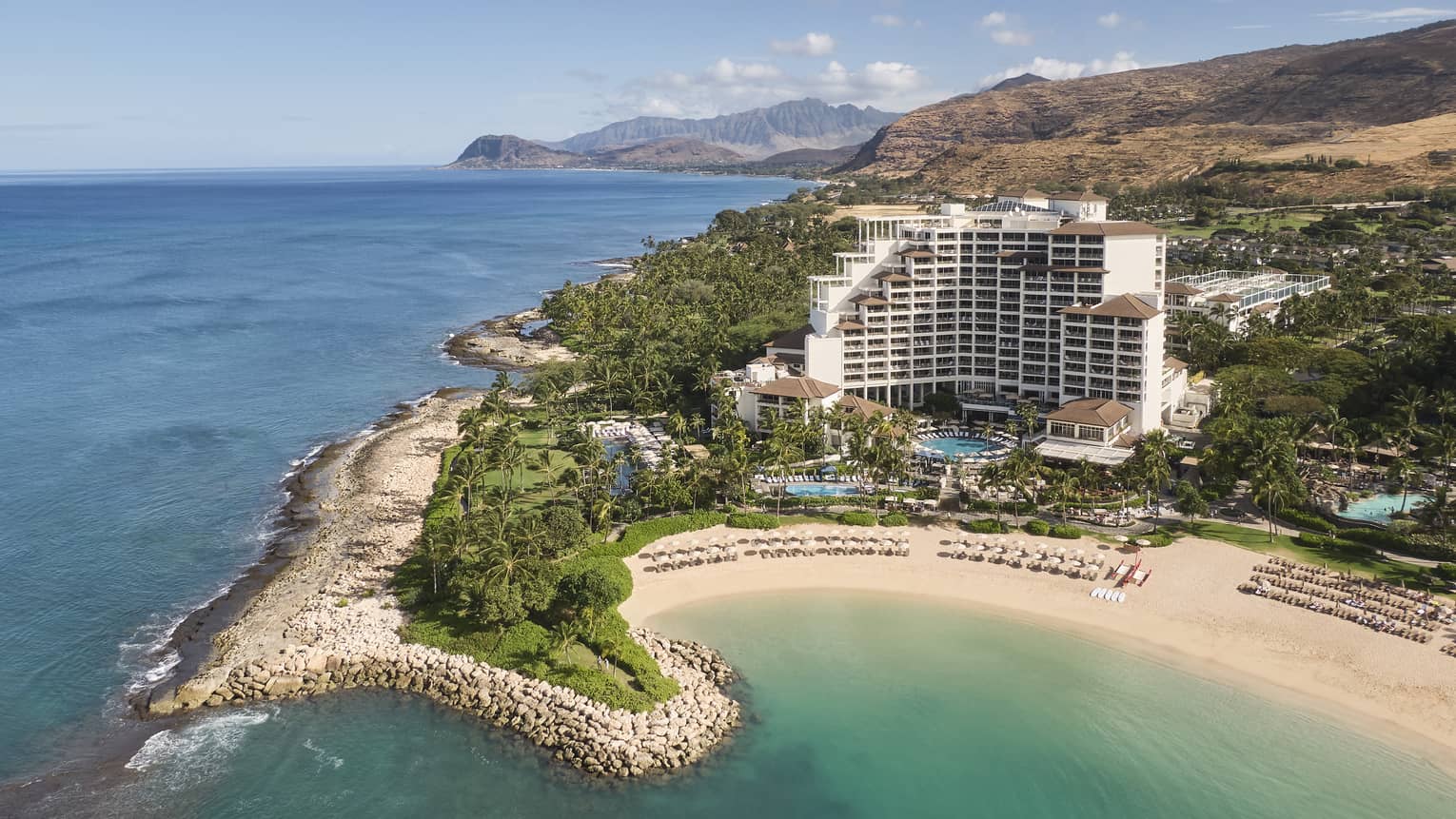 Exterior view of Four Seasons Resort Oahu on waterfront peninsula