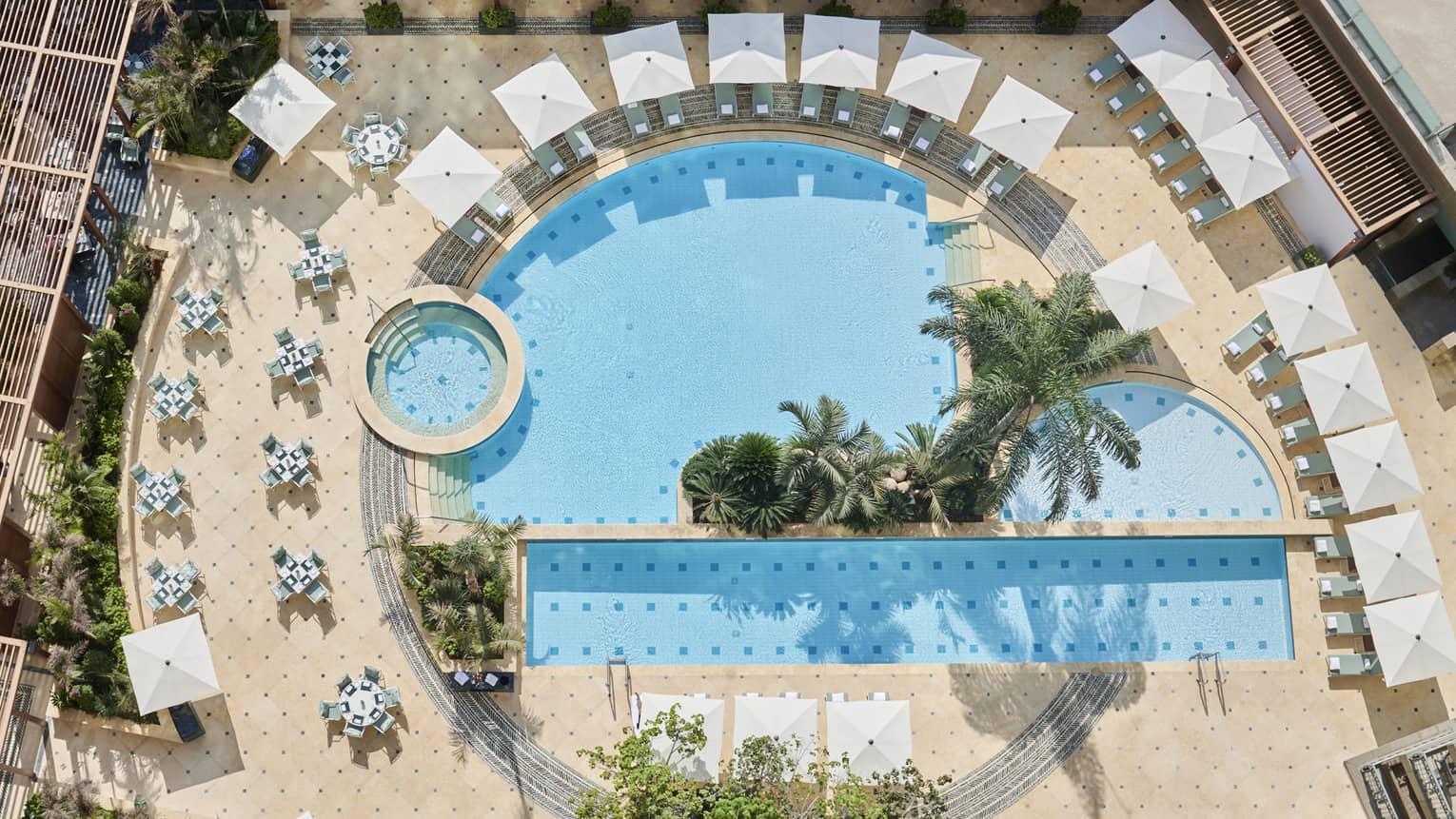 Aerial view of the outdoor pools surrounded by lounge chairs