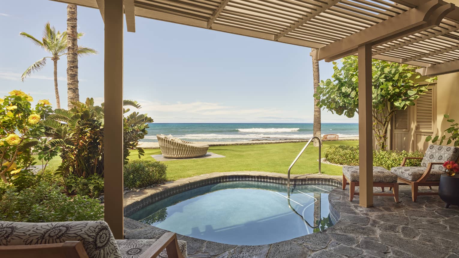 Private stone terrace with wooden pergola, plunge pool and beach view