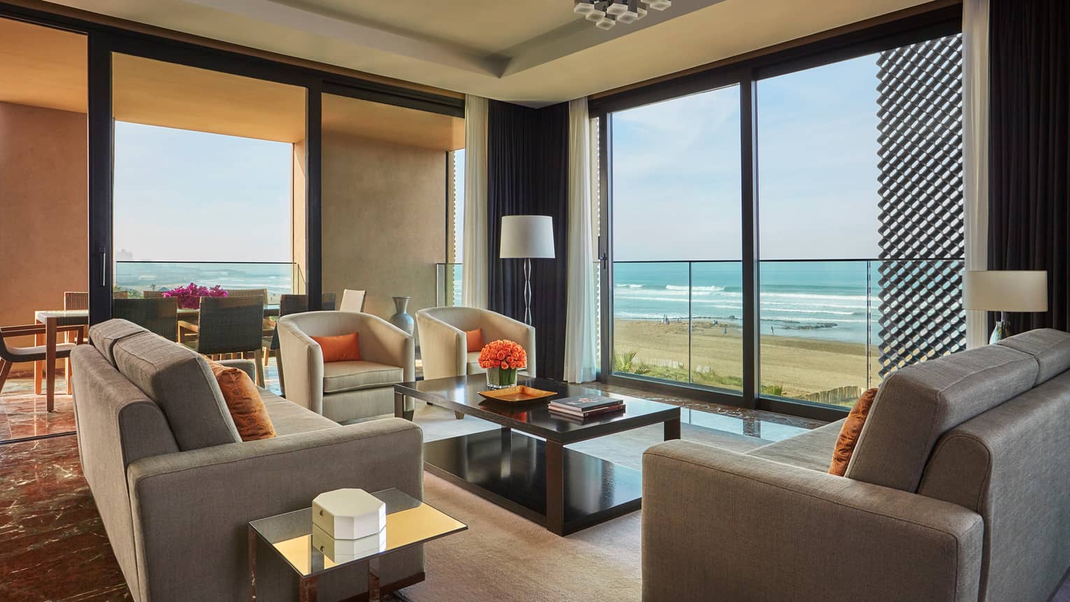 Imperial Suite Ocean View living room sofas, armchairs, corner windows with view of beach, Atlantic