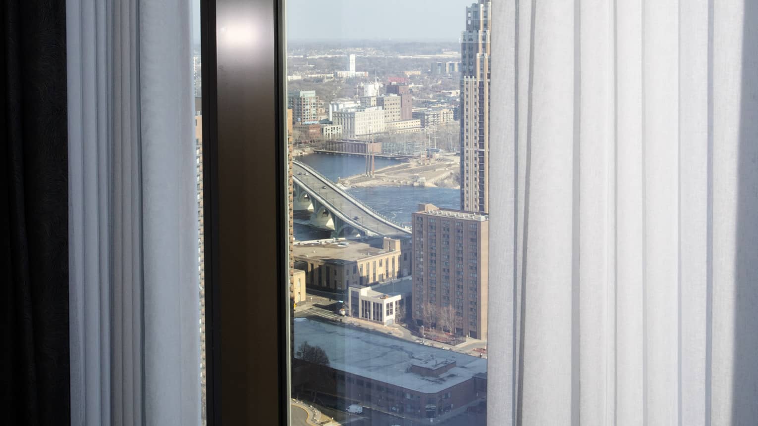 View of Minneapolis through luxury suite window at Four Seasons Hotel Minneapolis