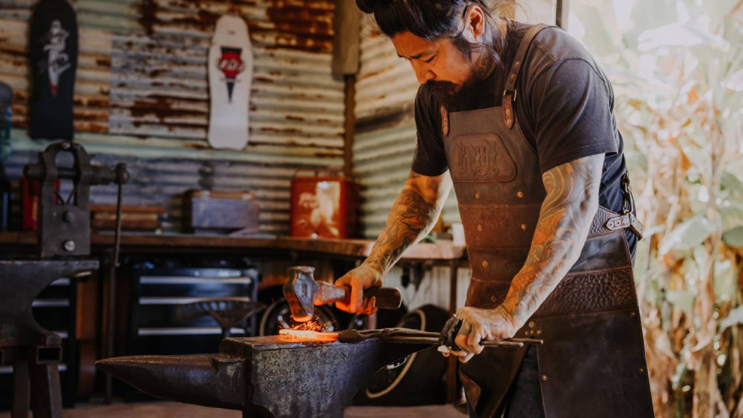 A blacksmith forges a knife in his Hawaii Island shop