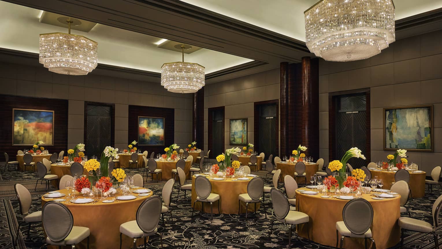 Al Manama ballroom, round banquet tables under crystal chandeliers 