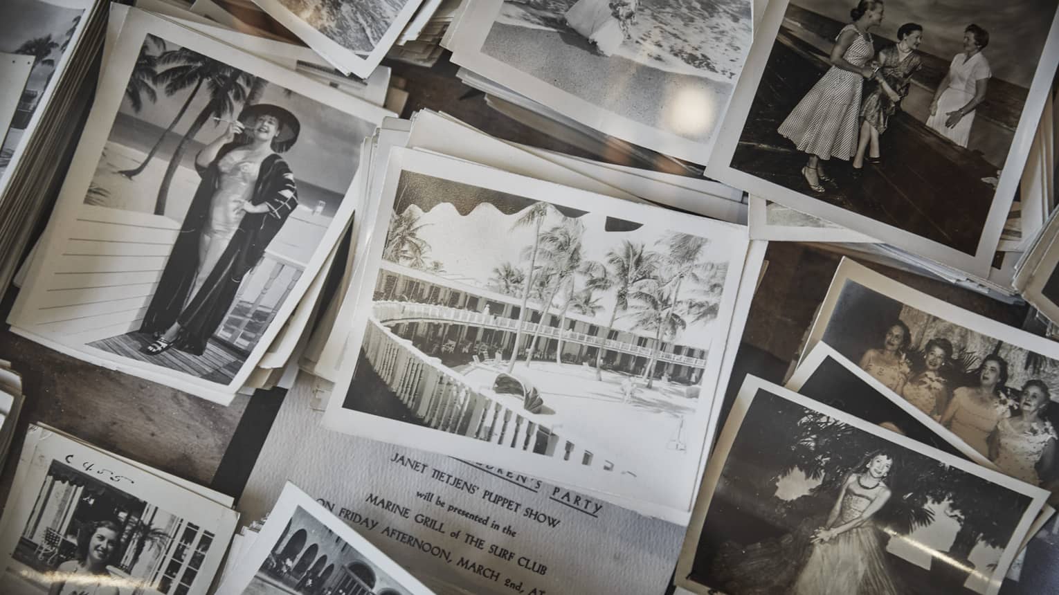 Breakfast with a Historian. Stacks of black-and-white photos show former guests and historic resort