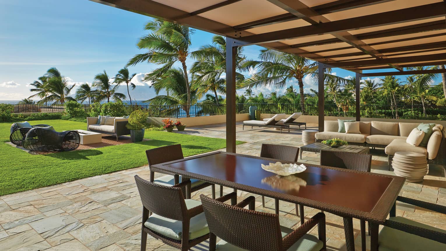Lokelani Suite Outdoor Area with dining table and view of the ocean