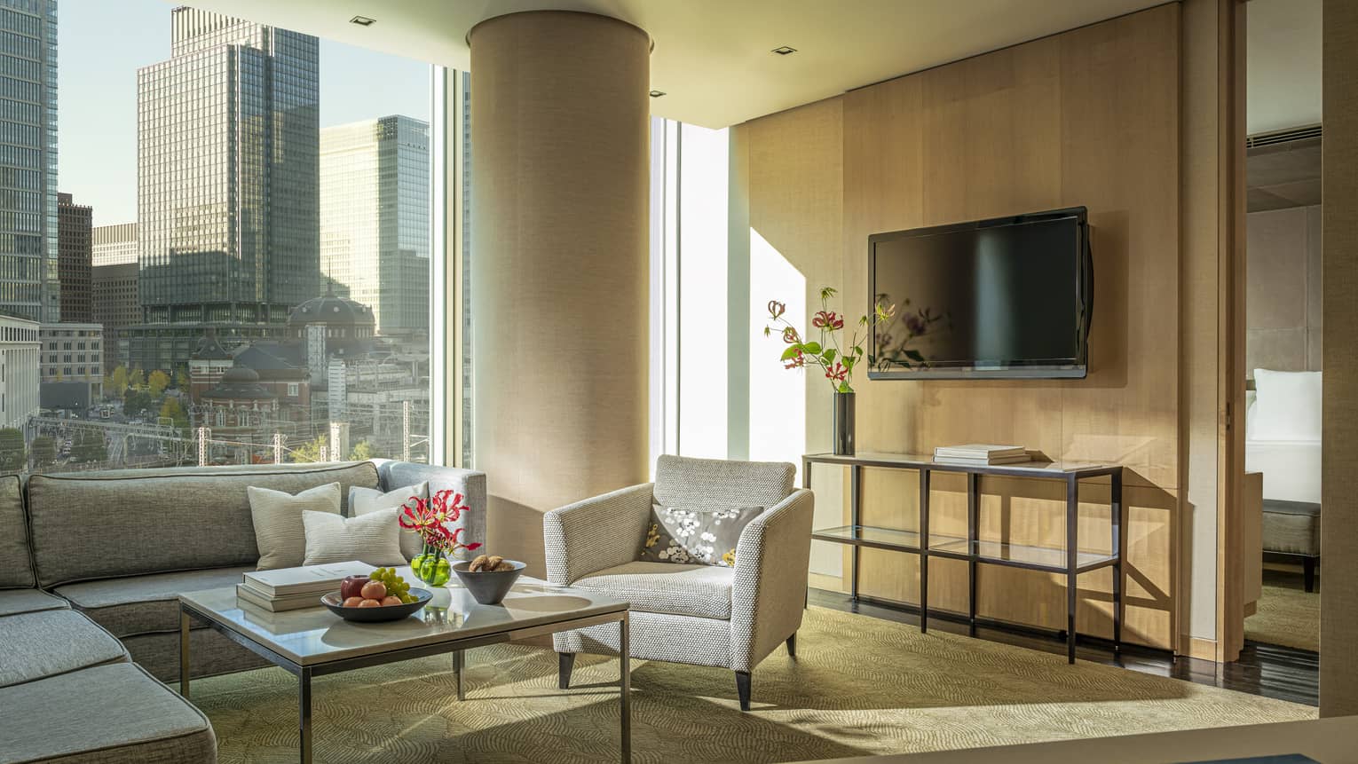 Four Seasons Executive Suite living area with floor-to-ceiling windows with downtown city views