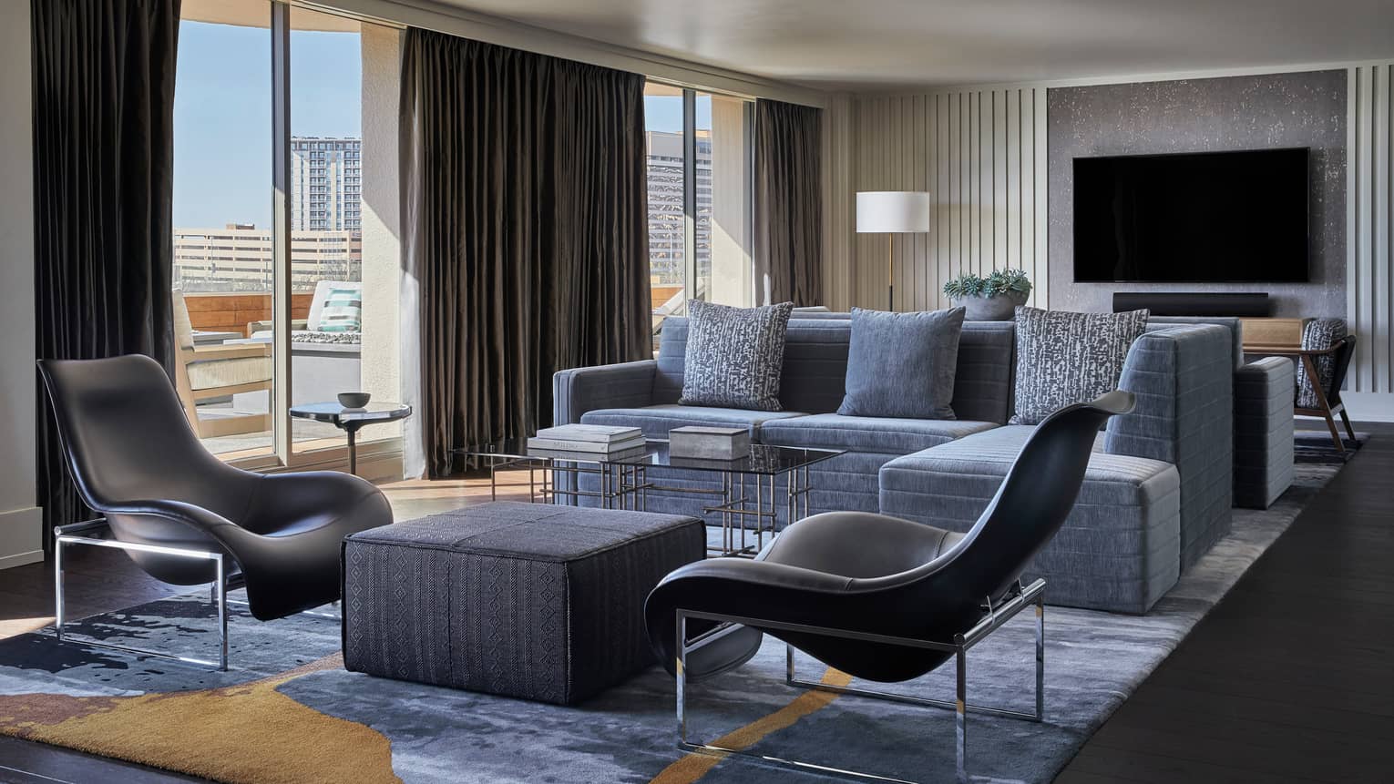Congressional Suite modern sectional sofa, accent chairs, floor-to-ceiling windows, TV