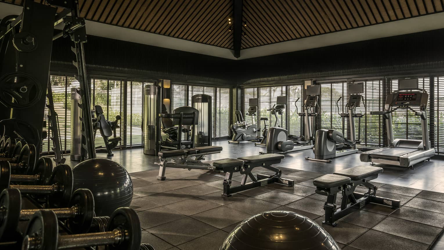 A spacious fitness center with various exercise equipment